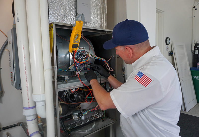 Sierra Air technician testing a furnace during a tune-up