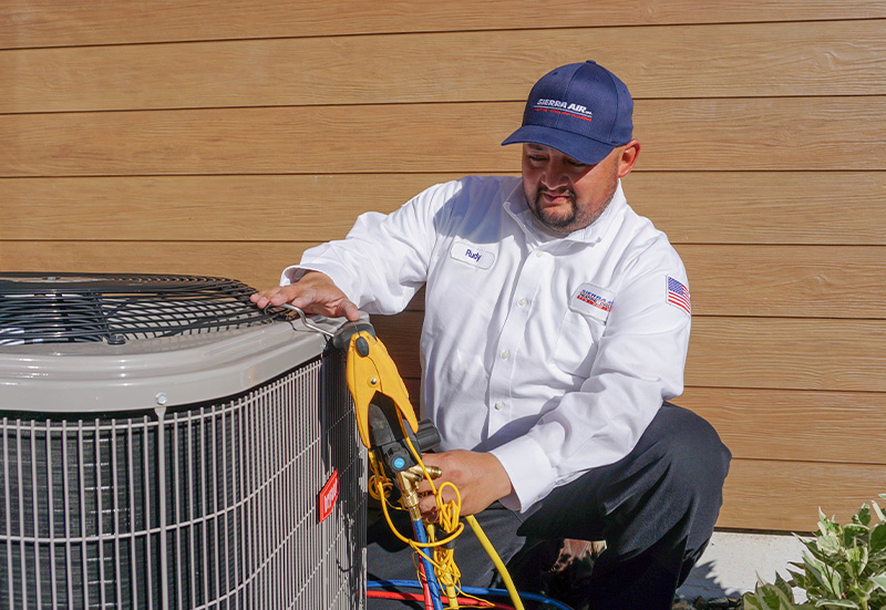 Technician with AC Condenser (4)