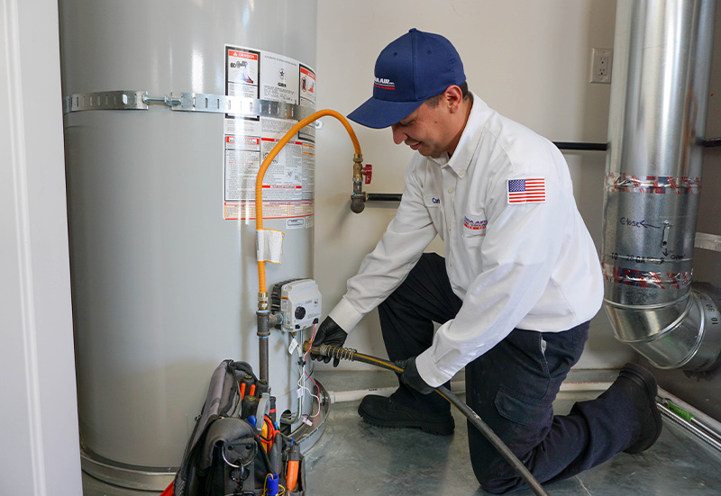 Technician with Tanked Heater (2)