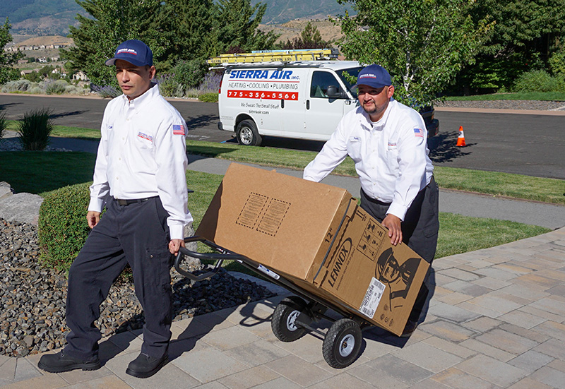 Technicians unloading delivering AC unit (1)