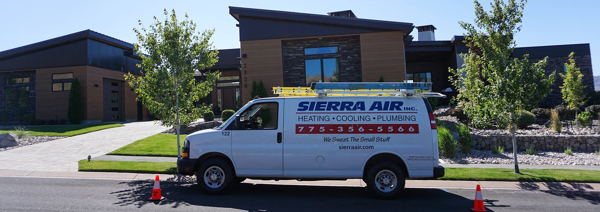 Sierra Air service van parked outside a modern Reno, NV home on a clear, hot summer day