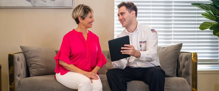 Sierra Air comfort advisor reviewing cooling options with a Reno homeowner in her living room
