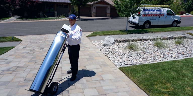 Sierra Air technician delivering a Halo whole-house water filtration system to a Reno, NV home